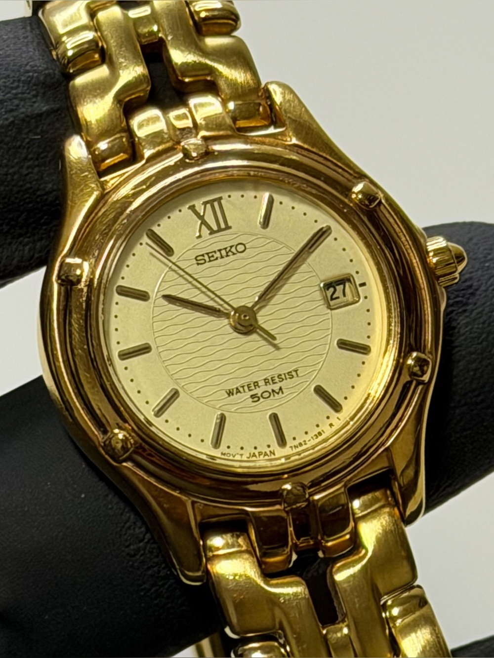 Seiko 7N82-0599 Date Champagne Dial Ladies’ Gold-Tone 27mm Dress Watch